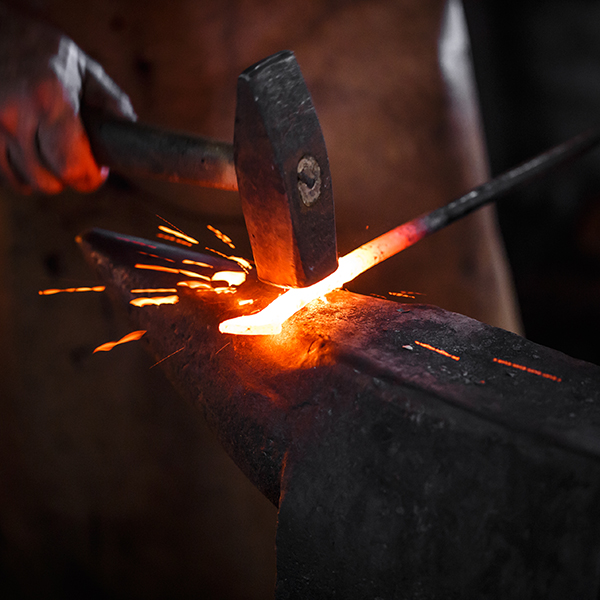 The,Blacksmith,Manually,Forging,The,Molten,Metal,On,The,Anvil